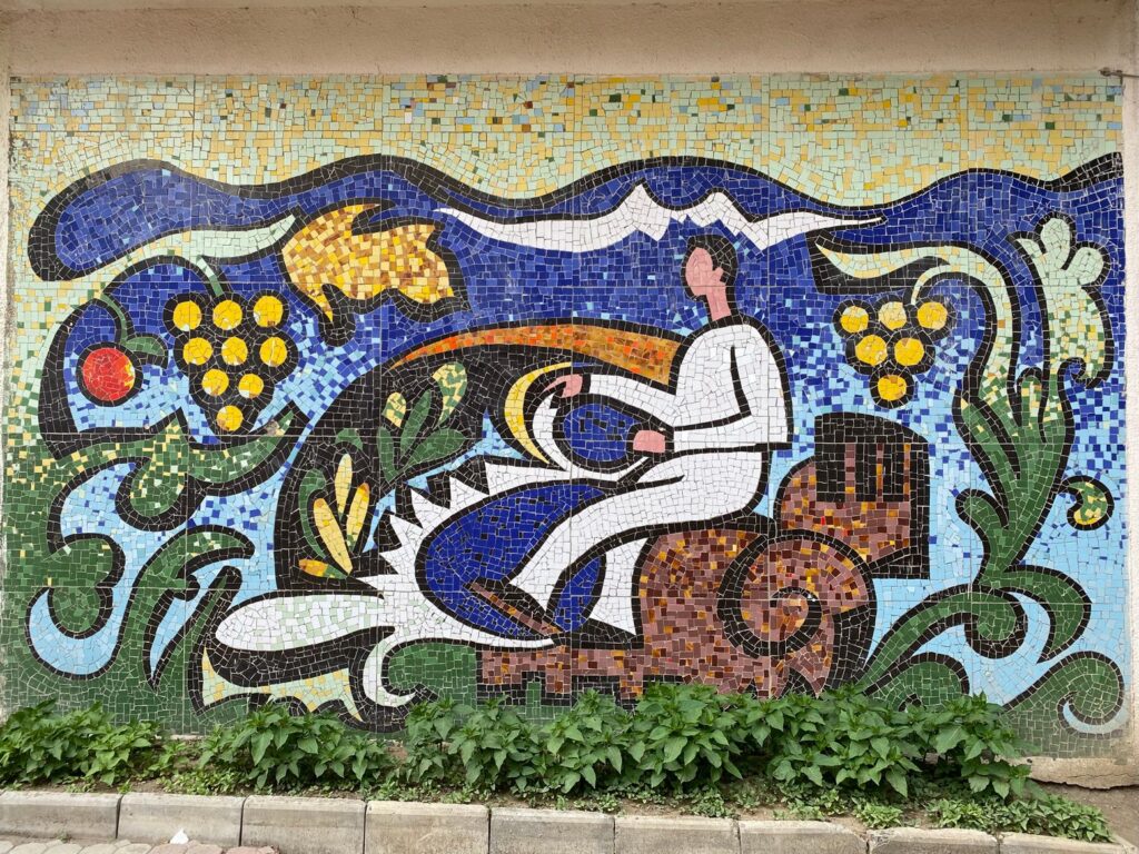 Two mosaic panno on the wall of Sokhumi State University, Building II, Former Institute of Machine Engineering